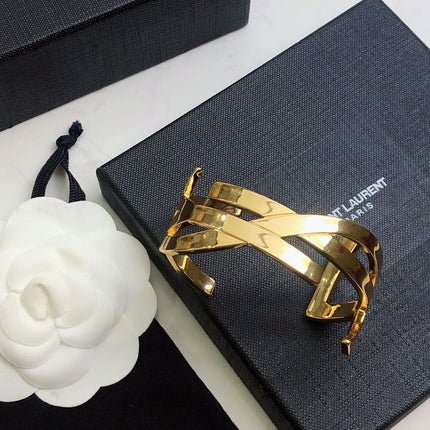 YSL 26S CRISS CROSS OPEN CUFF BRACELET IN GOLD TONE METAL 635064