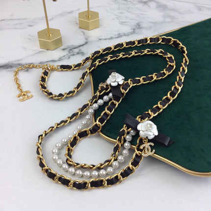 CHANEL 25S CHAIN BELT IN WHITE PEARL AND BLACK CALFSKIN 614403