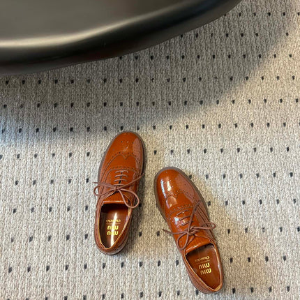 MIUMIU 26S LACE-UP BROGUE LOAFERS IN RUST ORANGE PATENT CALFSKIN