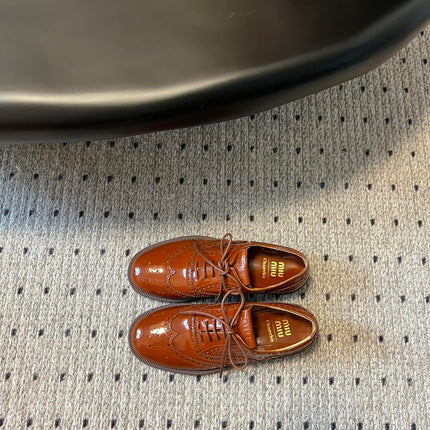 MIUMIU 26S LACE-UP BROGUE LOAFERS IN RUST ORANGE PATENT CALFSKIN