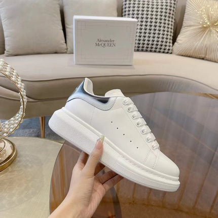 OVERSIZED SNEAKER IN WHITE CALFSKIN WITH GLOSSY BLACK AND WHITE HEEL TAB