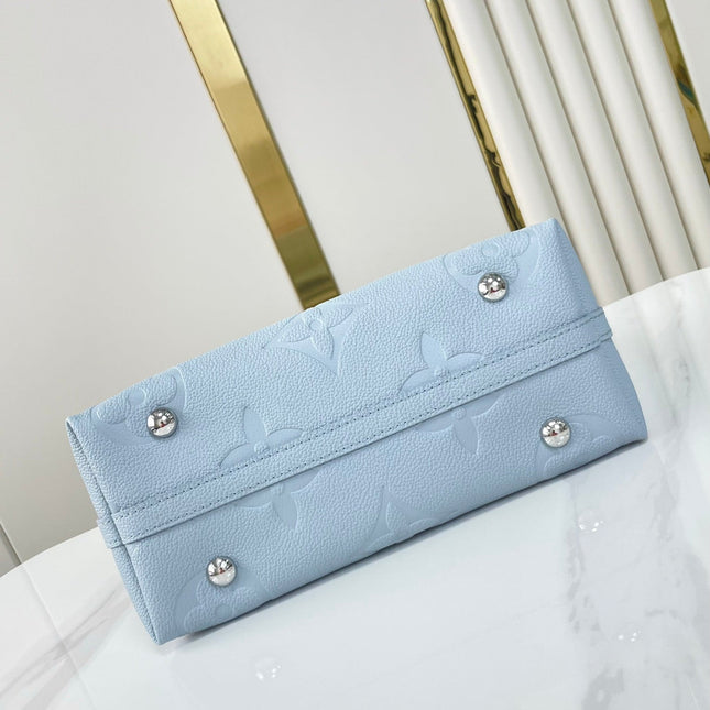 CARRYALL PM 29 IN BEAU BLUE MONOGRAM EMPREINTE LEATHER