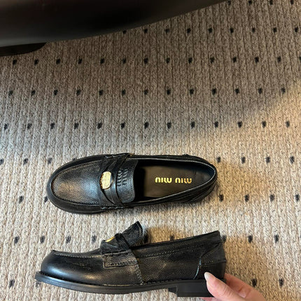 MIUMIU 26S PENNY LOAFERS IN BLACK CALFSKIN GOLD HARDWARE