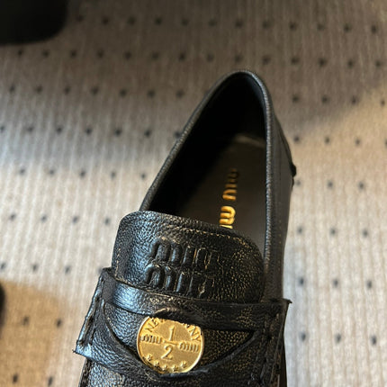MIUMIU 26S PENNY LOAFERS IN BLACK CALFSKIN GOLD HARDWARE