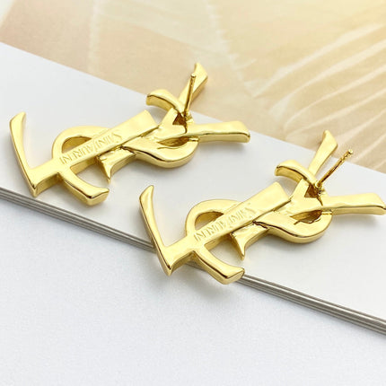 YSL 26S MONOGRAM DROP EARRINGS IN GOLD TONE METAL 629923