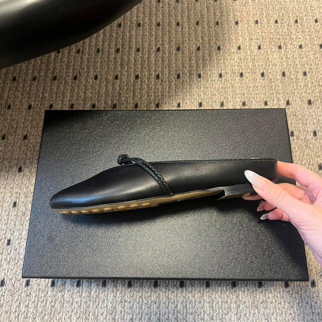 BOTTEGA VENETA 26S FLAT MULES IN BLACK LAMBSKIN
