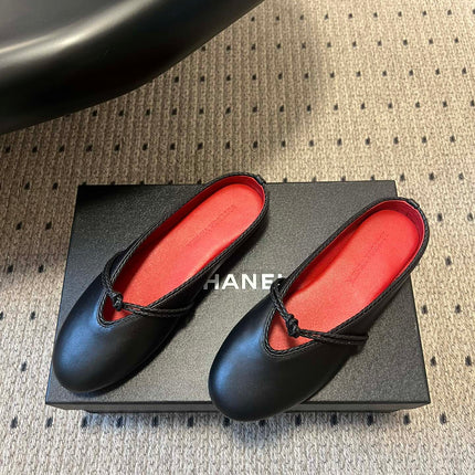 BOTTEGA VENETA 26S FLAT MULES IN BLACK LAMBSKIN