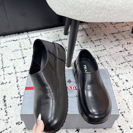 PRADA 26S SLIP ON SHOES IN BLACK SMOOTH CALFSKIN