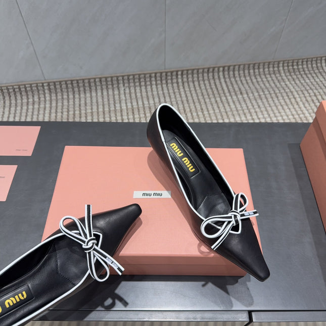 MIUMIU 26S POINTED TOE PUMPS 55MM IN BLACK AND WHITE CALFSKIN WITH BOW