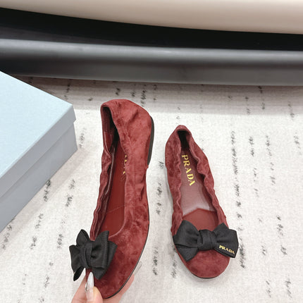 PRADA 26S ROUND TOE FLATS WITH BOW IN DARK RED SUEDE