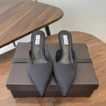 ALAIA 26S HEELED MULES 50 MM IN BLACK FABRIC