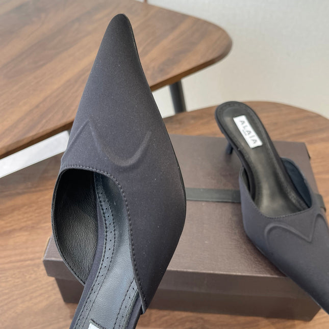 ALAIA 26S HEELED MULES 50 MM IN BLACK FABRIC