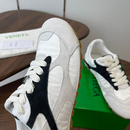BOTTEGA VENETA 26S ORBIT FLASH SNEAKERS IN WHITE AND BLACK SUEDE