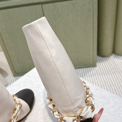 CHANEL 25S CALF-LENGTH BOOTS 45MM IN WHITE AND BLACK CALFSKIN GOLD HARDWARE