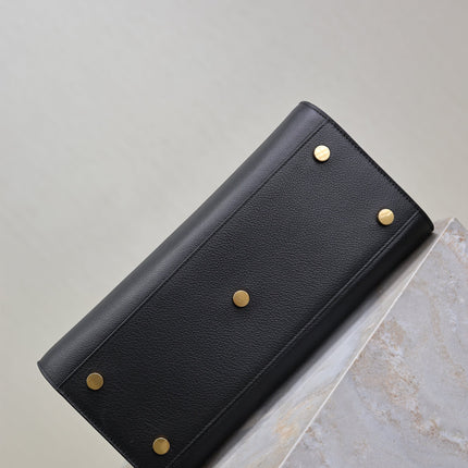 YSL 25S SAC DE JOUR GM 32 IN BLACK SUPPLE GRAINED CALFSKIN GOLD HARDWARE