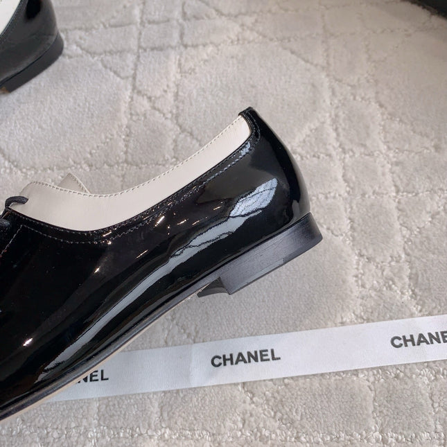 CHANEL 25S TWO TONE LACE UP IN BLACK AND WHITE SHINY CALFSKIN