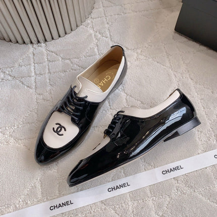 CHANEL 25S TWO TONE LACE UP IN BLACK AND WHITE SHINY CALFSKIN