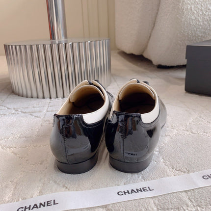 CHANEL 25S TWO TONE LACE UP IN BLACK AND WHITE SHINY CALFSKIN