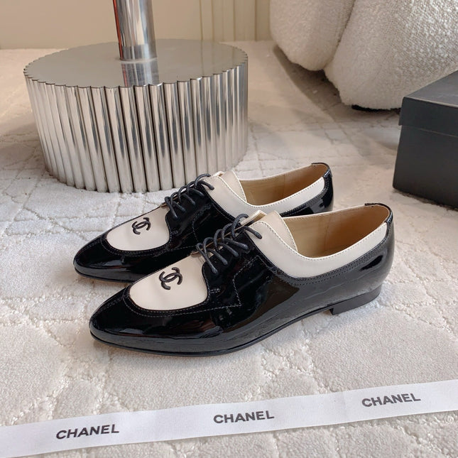 CHANEL 25S TWO TONE LACE UP IN BLACK AND WHITE SHINY CALFSKIN