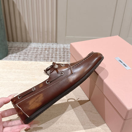 MIUMIU 25S BOAT SHOES IN SIENNA BROWN BLEACHED CALFSKIN WITH SHEARLING
