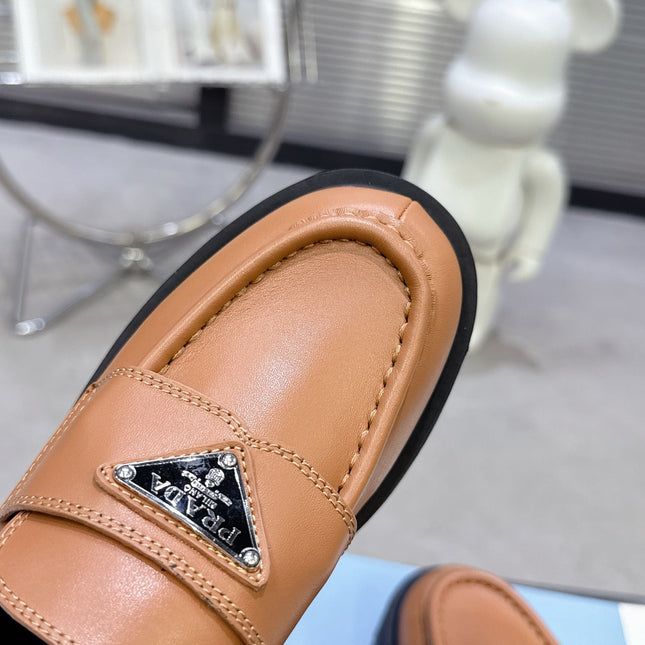 PRADA 25S THICK-SOLE LOAFERS 60 MM IN COGNAC BROWN CALFSKIN