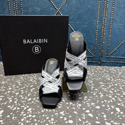 BALMAIN 26S HIGH-HEEL SANDALS 95 MM IN BLACK CALFSKIN AND WHITE FABRIC