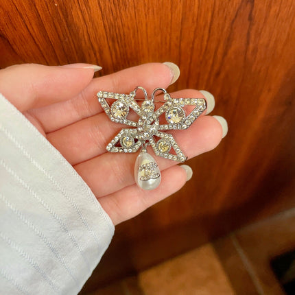 CHANEL 26S DOUBLE C LOGO CRYSTAL BOW PEARL DROP BROOCH 629165