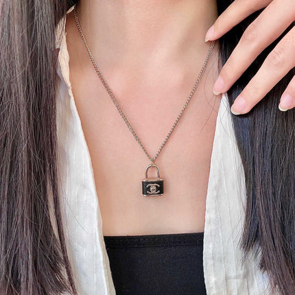 CHANEL 26S DOUBLE C LOGO PADLOCK CHAIN NECKLACE IN GOLD & BLACK METAL 629974