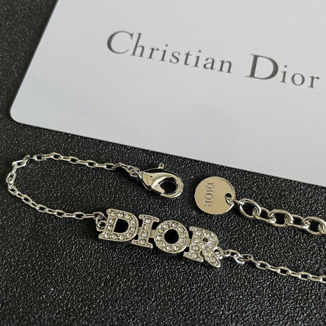 CD 26S PAVE LOGO LETTER BRACELET IN SILVER TONE METAL 631807