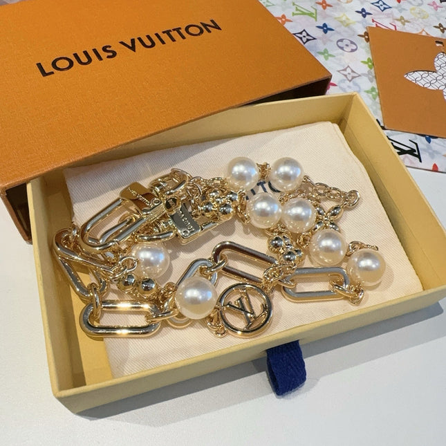 GOLD-TONE BAG CHAIN WITH PEARL DETAILS AND A LOGO CHARM