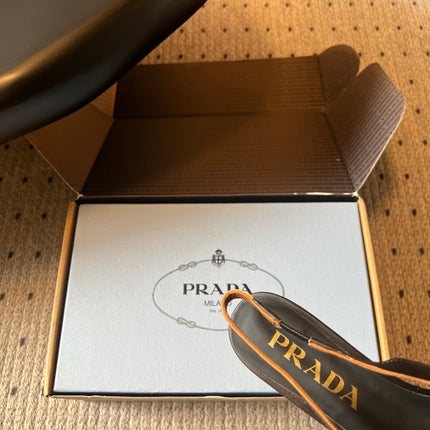 PRADA 26S POINTED TOE FRINGE BOW SLINGBACK PUMPS 55MM IN BLACK CALFSKIN