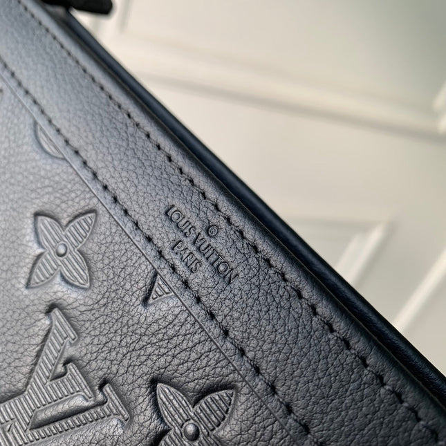 POCHETTE VOYAGE 22 IN BLACK MONOGRAM SHADOW CALFSKIN
