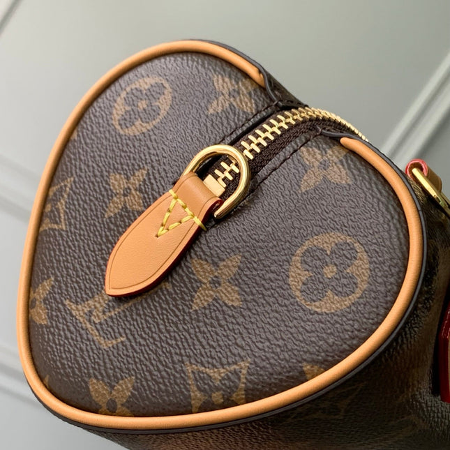 NANO SPEEDY DATING 18 IN BROWN COATED CANVAS GOLD HARDWARE