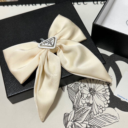 BOW-KNOT HAIR CLIP IN EGG SHELL SILK 358294