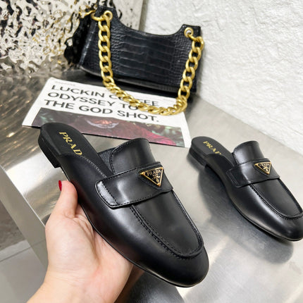 PRADA 26S MULE LOAFERS IN BLACK CALFSKIN WITH LOGO