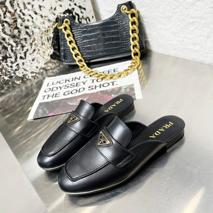 PRADA 26S MULE LOAFERS IN BLACK CALFSKIN WITH LOGO