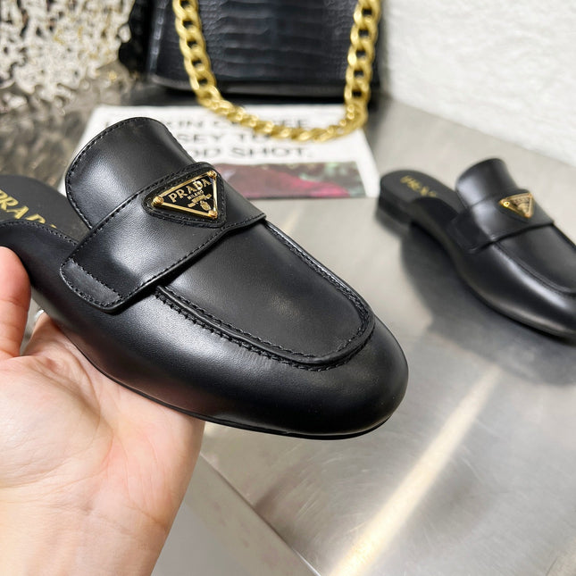 PRADA 26S MULE LOAFERS IN BLACK CALFSKIN WITH LOGO
