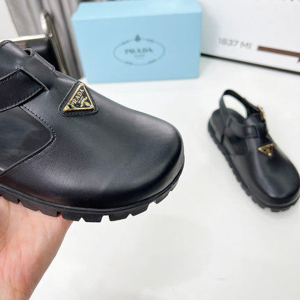 PRADA 26S RUBBER LOGO CHUNKY SOLE FISHERMAN SANDALS IN BLACK CALFSKIN
