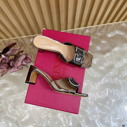 VALENTINO 25S HIGH-HEEL MULES 60 MM IN METALLIC SILVER PATENT CALFSKIN WITH CRYSTAL-EMBELLISHED STRAP