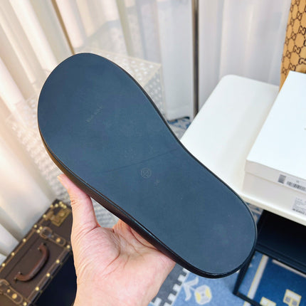 THE ROW 26S CROSSED PADDED SLIDES IN BLACK CALFSKIN