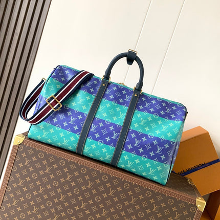 LV 26S KEEPALL 50 IN BLUE WITH LIGHT BLUE ACCENTS COATED CANVAS