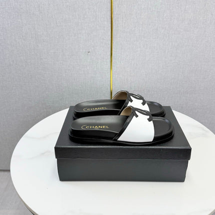CHANEL 26S ICONIC CC SLIDES IN WHITE LAMBSKIN