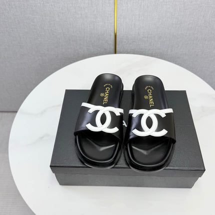 CHANEL 26S ICONIC CC SLIDES IN BLACK LAMBSKIN