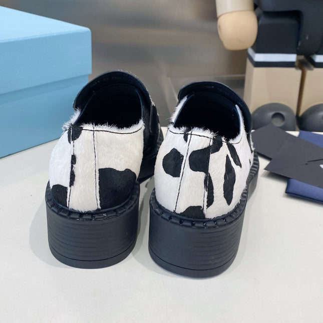 PRADA 26S LOAFERS IN WHITE AND BLACK COW PRINT PONY HAIR