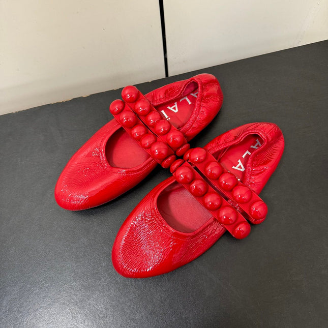 ALAIA SPHERE BALLET FLATS IN CHERRY RED LAMBSKIN
