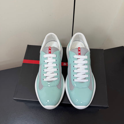 PRADA 26S SNEAKERS IN SOFT TEAL PATENT CALFSKIN AND WHITE MESH