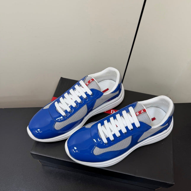 PRADA 26S SNEAKERS IN DARK BLUE PATENT CALFSKIN AND WHITE MESH