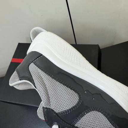 PRADA 26S SNEAKERS IN GRAY PATENT CALFSKIN AND WHITE MESH