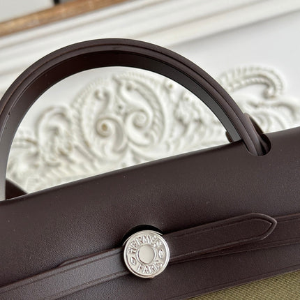 ZIP CABINE 31 BAG IN OLIVE GREEN CANVAS AND BLACK CALFSKIN