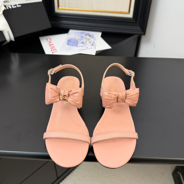 FLAT SANDALS IN PEACHY PINK CALFSKIN WITH BOW